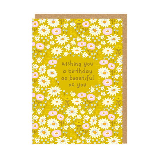 Yellow birthday card with a floral design and text reading Wishing You A Birthday As Beautiful As You