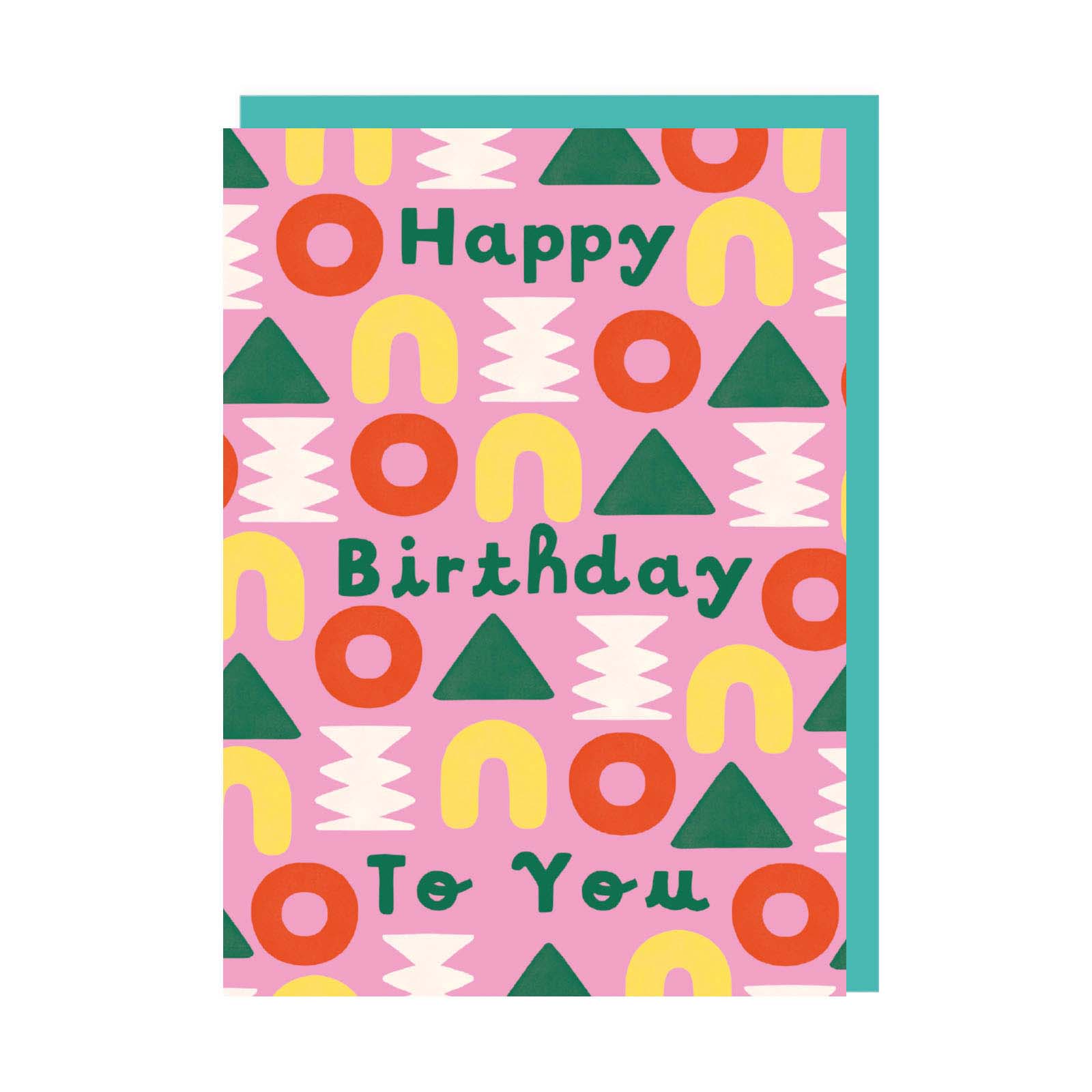 Pink birthday card with multi-colour shape pattern and green text reading Happy Birthday To You