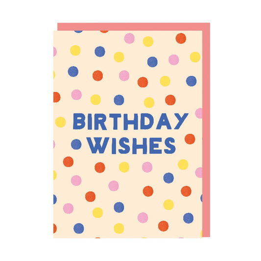 Birthday card with a vibrant multi-colour polka dot pattern and blue text that reads Birthday Wishes