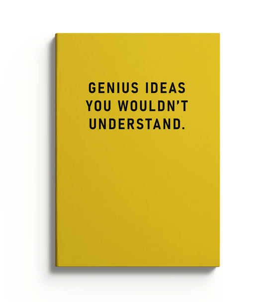 Notebook with a yellow cover and black text reading Genius Ideas You Wouldn't Understand