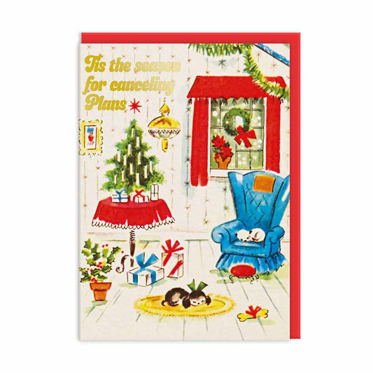 Chrismas Card with a festive scene, the gold foil text "Tis The Season For Cancelling Plans"