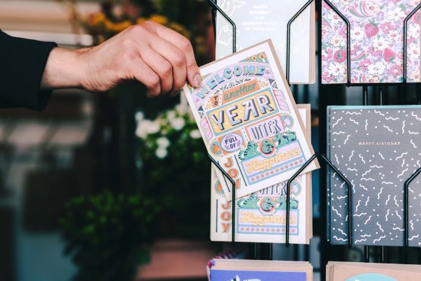 customer buying a greeting card